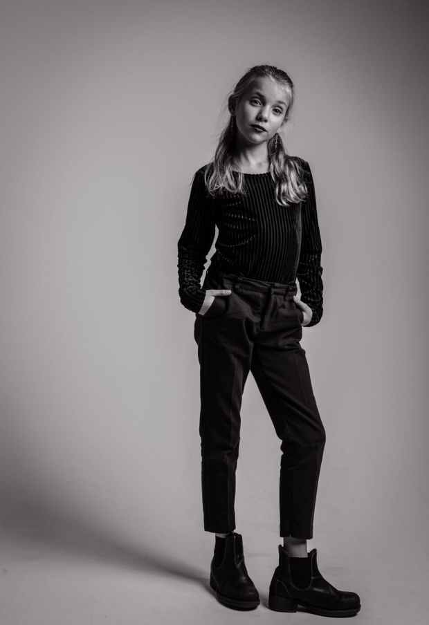 grayscale photography of girl in long sleeved top and jeans outfit